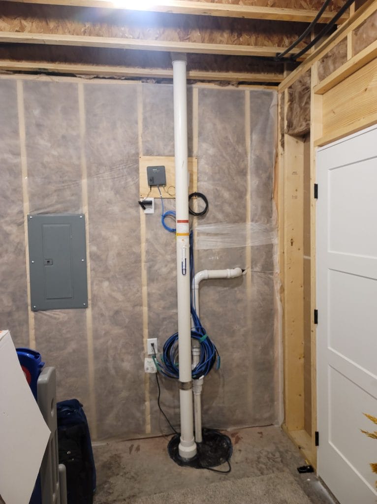 Radon mitigation system in new construction basement